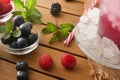 Detail of berry drink with ice and fruit around Royalty Free Stock Photo