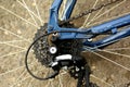 Detail of a bicycle wheel with spokes, chain and gearshift hub. Royalty Free Stock Photo