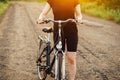 Detail of a bicycle. Woman riding her bicycle. Bicycle on road