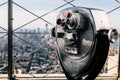 Detail of binoculars and background view of New York City from the Empire State Building. USA America, Manhattan