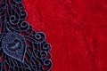 Detail of black lace on red velvet Royalty Free Stock Photo