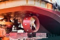 Detail of black stern and ship propeller, rudder red after maintenance already.