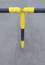 Detail of black and yellow metal security barrier. Fixed gate barrier. Beaconing and signaling concept. Roadblock Road Barrier