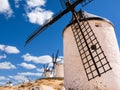 Detail of the blades of a windmill in Consuegra and other windmills in the background (spain