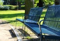 Detail of blue bench at spring park Royalty Free Stock Photo