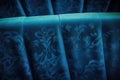 detail of a blue fabric cinema seat