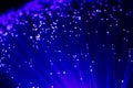 Detail of blue growing bunch of optical fibers background, fast