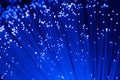 Detail of blue growing bunch of optical fibers background, fast