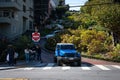 blue Jeep Wrangler driving down Lombard Street