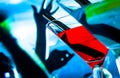 Detail of blue and red cocktail drink on a disco table with space for text Royalty Free Stock Photo