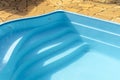 Detail of blue swimming pool and stone floor Royalty Free Stock Photo