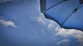 Detail of a blue umbrella on the beach by the Ligurian sea, in Spotorno Royalty Free Stock Photo