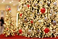 Detail Blurred View of an opulent Christmas Tree Decoration in a Shopping Center during Christmas Time - Bokeh Background Royalty Free Stock Photo