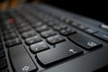 Detail of a brand new modern black laptop keyboard with the focus on the Enter key Royalty Free Stock Photo