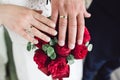 Detail of bride`s bouquet and hands holding Royalty Free Stock Photo