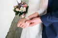 Detail of bride`s bouquet and hands holding Royalty Free Stock Photo