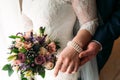 Detail of bride`s bouquet and hands holding Royalty Free Stock Photo