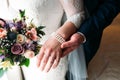 Detail of bride`s bouquet and hands holding Royalty Free Stock Photo