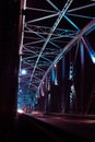 Detail of a bridge with road for cars at night. Many lights over