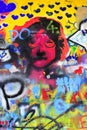 Detail of bright colorful John Lennon`s wall with graffiti in Prague