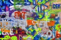 Detail of bright colorful John Lennon`s wall with graffiti in Prague