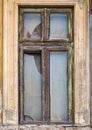 Detail with a broken wooden frame window . Worn out building in the center of Bucharest, Romania Royalty Free Stock Photo