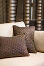 Detail of brown pillow on the beige sofa Royalty Free Stock Photo