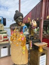 Detail of Buddha gold statues and statue of The famous monk named Luang Pu Mun in Chachoengsao at Thailand