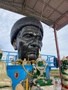 Detail of Buddha gold statues and statue of The famous monk named Luang Pu Mun in Chachoengsao at Thailand