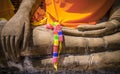 Detail of Buddha Statue in Wat Mahathat Temple with colored wreath laying on his hands, Thailand Royalty Free Stock Photo