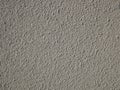 Detail of bumpy concrete wall painted in gray color Royalty Free Stock Photo