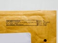 Detail of business envelope from Post NL Netherlands postal service with Prioritaire stamp printed on dot matrix printer