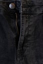 Detail of the button and zipper of a black denim pants Royalty Free Stock Photo