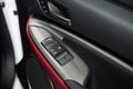 Detail on buttons controlling the windows in red car Royalty Free Stock Photo
