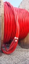 Detail of cable drum also called Electrical conductor reel with red cables to high-voltage