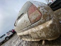 The detail of the car completely dirty by mud after the drag race