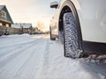 Detail of car tires in winter on the road covered with snow. Royalty Free Stock Photo