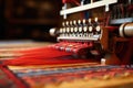 detail of carpet weaving machine in action
