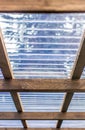 Roof of a carport with translucent corrugated plastic