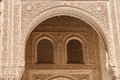 Detail on the carved arches of the Alahambra, Granada, Spain.