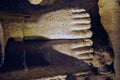 Detail carving of Buddhas feet on the wall of Ajanta Cave