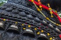 Detail carvings of bell on 350 year old monolithic statue of Nandi (Bull), Chamundi Hill, Mysore, India