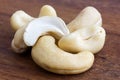 Detail of cashew nuts arranged on dark wood surface