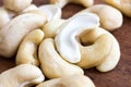 Detail of cashew nuts arranged on dark wood surface