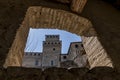 A detail of the castle of Torrechiara, Parma, Italy, framed by a stone window