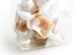 Detail of cellophane packet of wrapped caramel toffees. Royalty Free Stock Photo