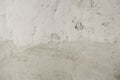 Plaster coating on old white lime washed wall