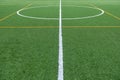 Detail of the center of an artificial grass 7-a-side football field Royalty Free Stock Photo