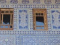 Ceramic decorated blue wall of an ancient madrasah of Khiva in Uzbekistan.