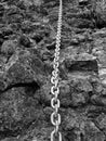 Detail of chain anchored in hard whinstone rock. Climbers path Royalty Free Stock Photo